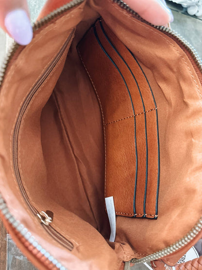 Stylish Leather Wristlet/Clutch features a zip closure with card slots, perfect for adding fun to any outfit.
