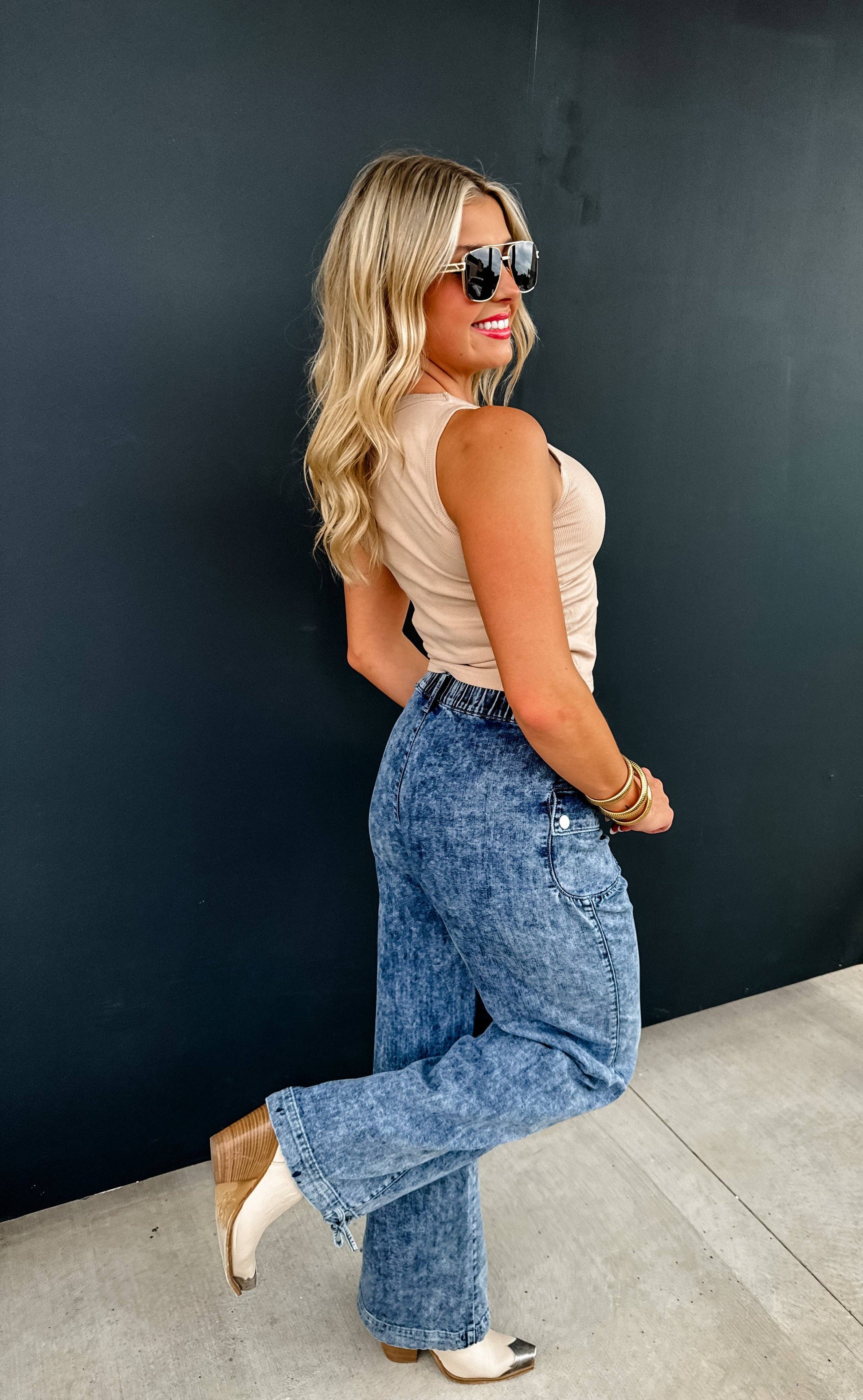 Charlie Cinch Hem Wide Leg Jeans on a model; elastic waist, front pockets, cinchable hem for a jogger look.