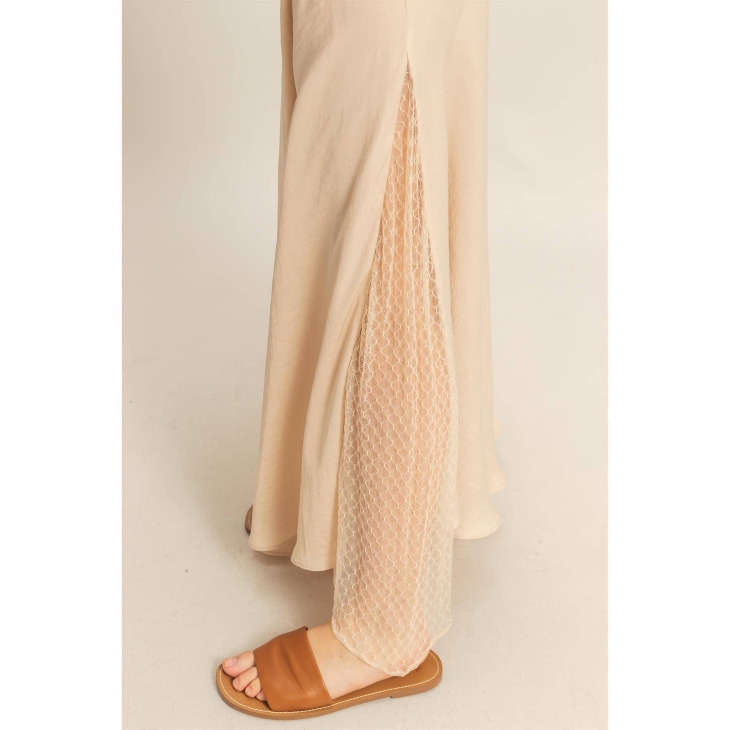 Lace Detail Satin Maxi Skirt features a lace panel and flowy hem, perfect for adding a flirty touch to summer outfits.