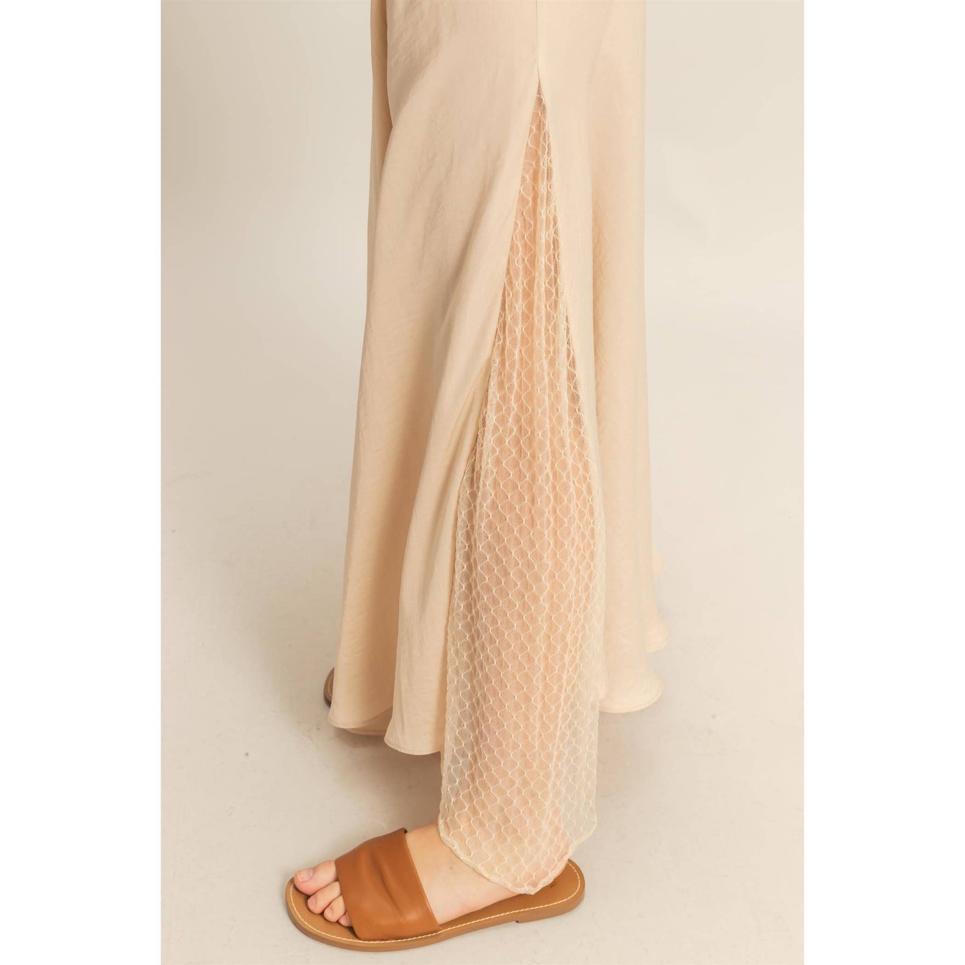 Lace Detail Satin Maxi Skirt features a lace panel and flowy hem, perfect for adding a flirty touch to summer outfits.