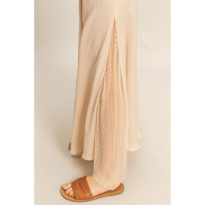 Lace Detail Satin Maxi Skirt features a lace panel and flowy hem, perfect for adding a flirty touch to summer outfits.