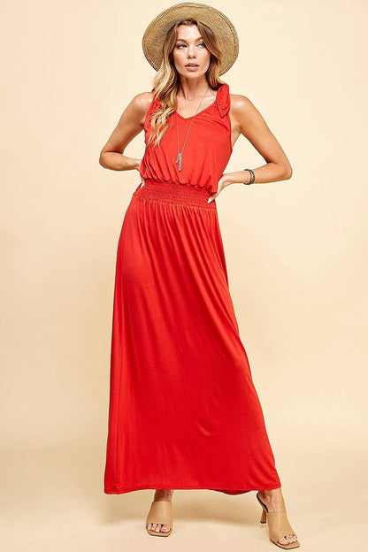 Stylish Lady in Red Dress featuring a smocked waistband for a flattering fit, perfect for any occasion at your favorite store.