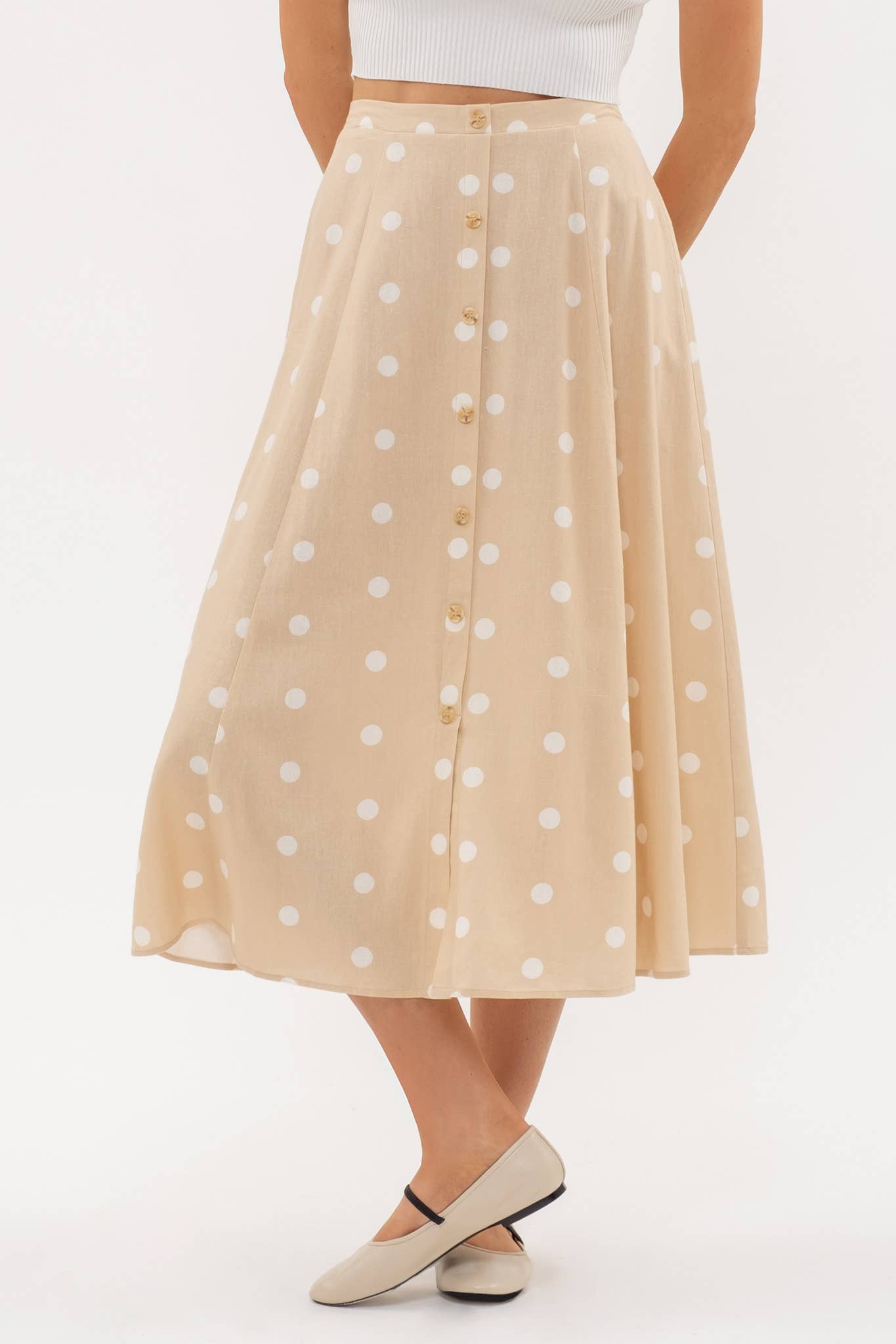 Stylish POLKA DOT BUTTON DOWN MIDI SKIRT featuring elasticized back waist and non-functional buttons for a chic look.