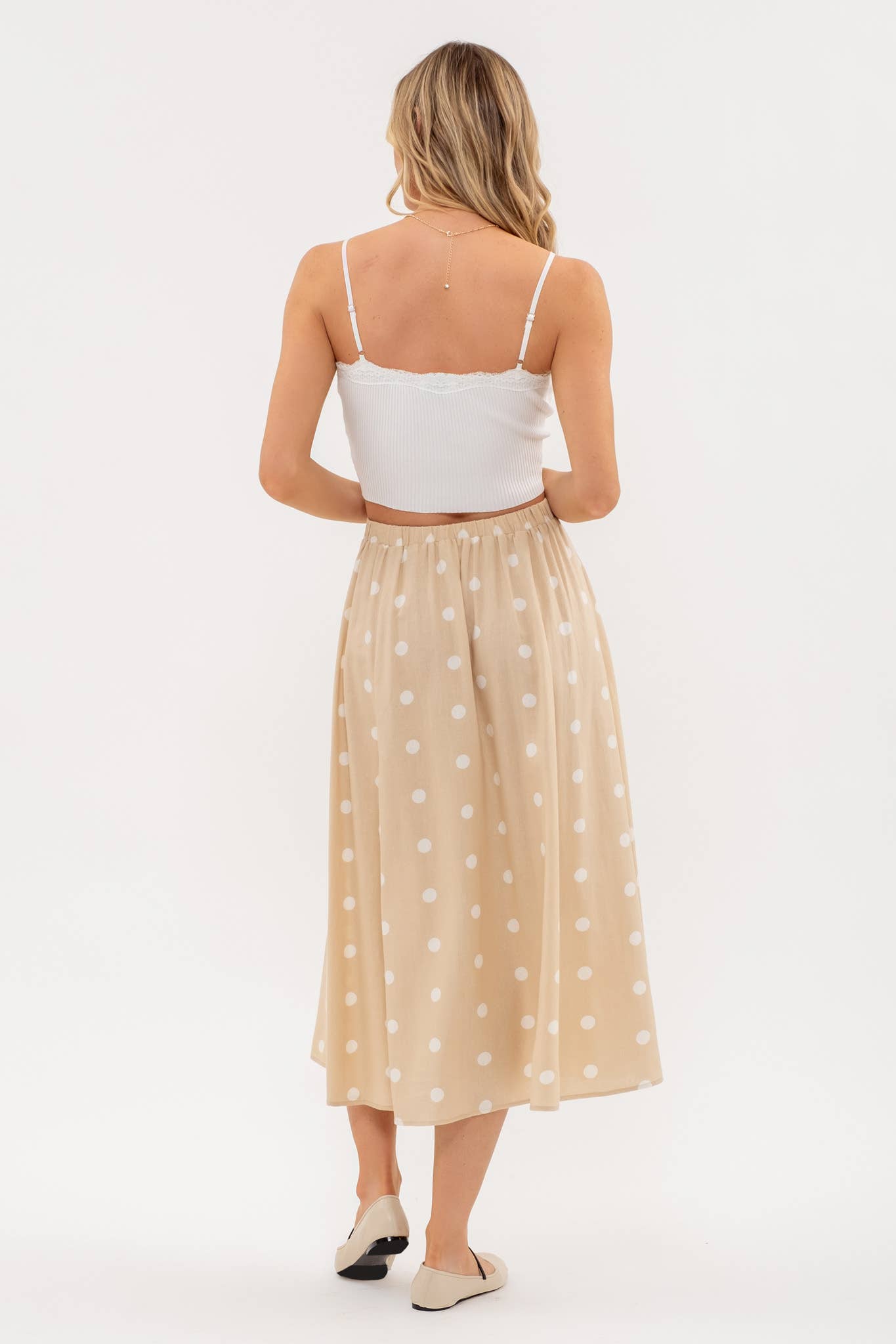 Stylish POLKA DOT BUTTON DOWN MIDI SKIRT featuring an elasticized back waist and non-functional buttons for a chic look.