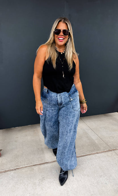 Charlie Cinch Hem Wide Leg Jeans on a model; light-wash denim with elastic waist and cinched hems.