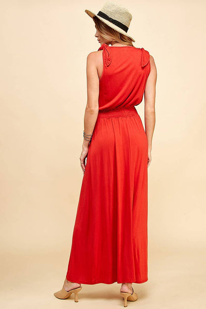 Stylish Lady in Red Dress showcasing a flattering smocking waistband, perfect for any occasion. Available at [Store Name].